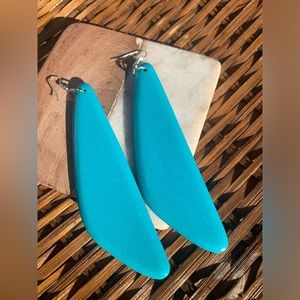 Handmade bohemian earrings made of wood and painted turquoise.